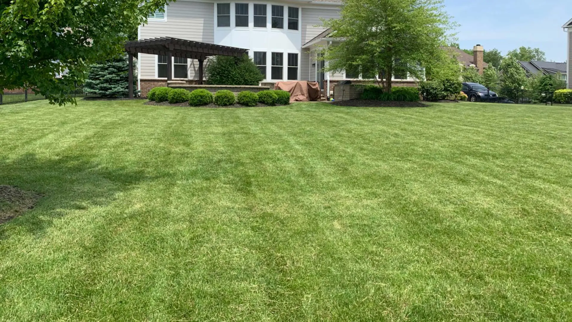 Noblesville customer with a lawn freshly mowed by Sprout Lawn & Landscape.