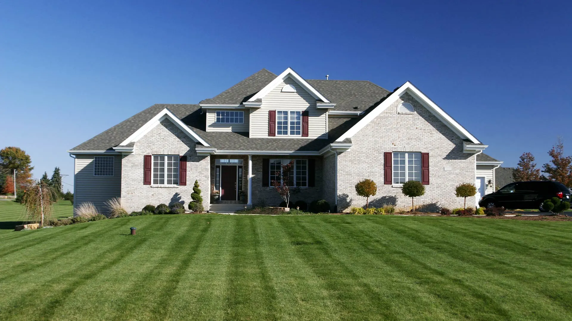 Freshly mowed lawn in homefront view in Carmel, IN.