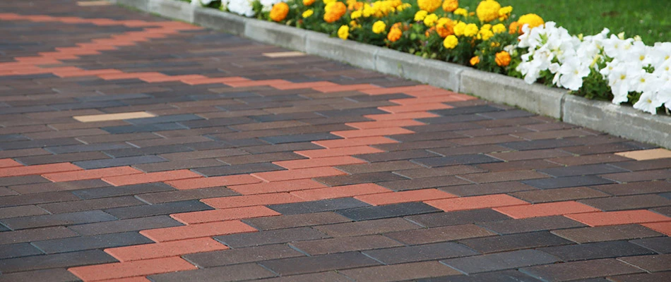 A custom decorative driveway built in front of a home in Carmel, IN.