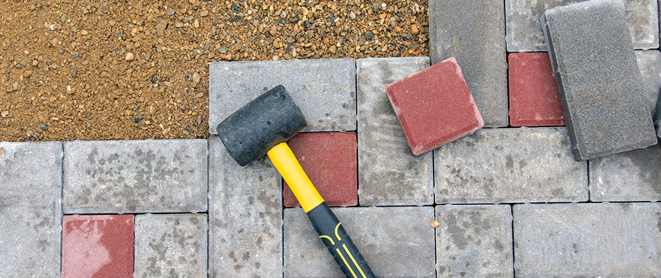 A paver patio being reconstructed behind a home in Westfield, IN. 