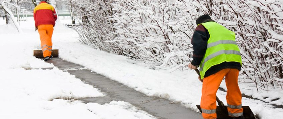 Our professionals removing snow off of a walkway at a commercial property in Fishers, IN. 