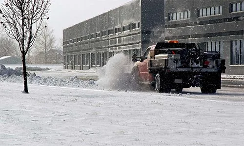 Snow being removed by truck and plow near Noblesville, IN.