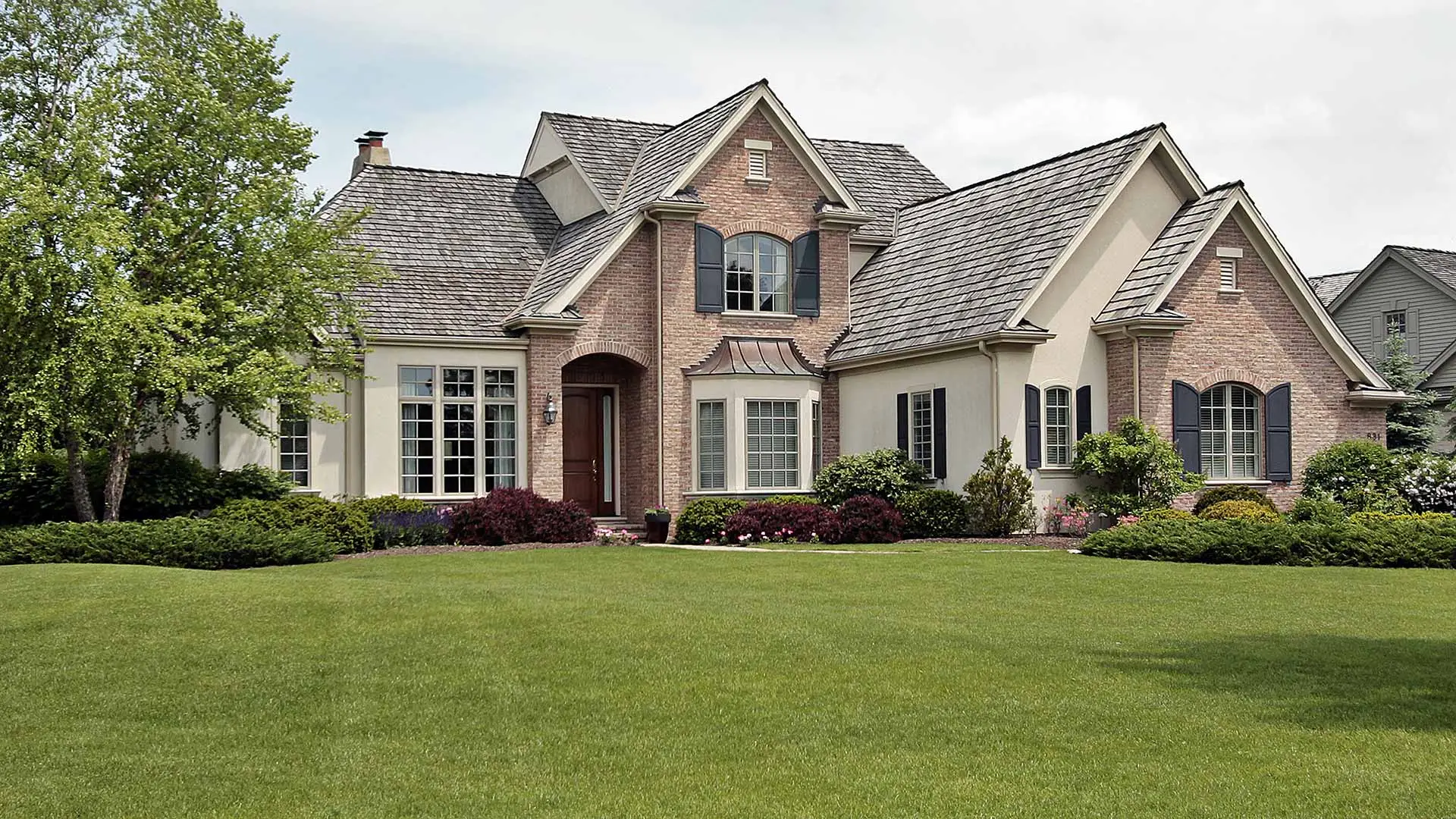 Well-maintained residential lawn by Sprout Lawn and Landscape